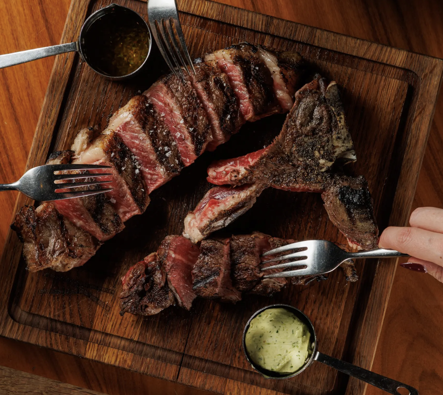 Bone-in steak sliced and plated tableside
