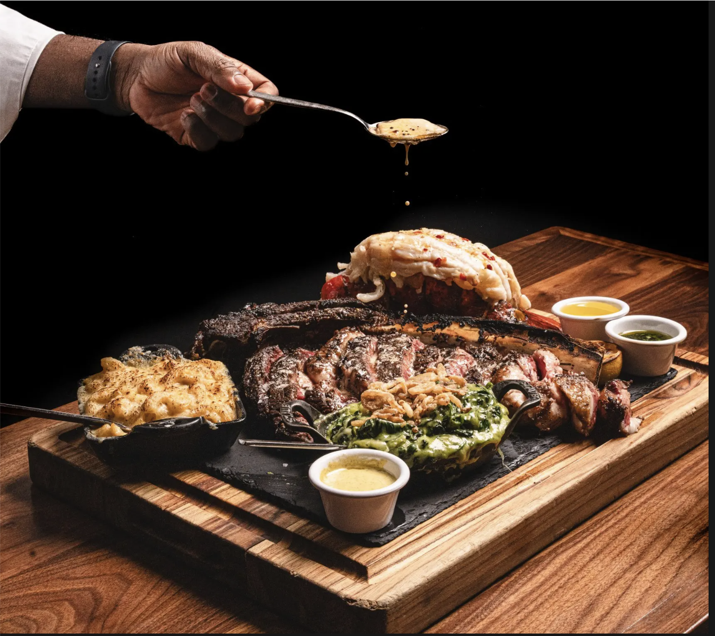 Tomahawk steak board finished with pan sauce
